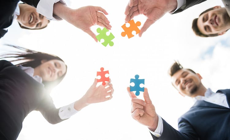 people holding puzzles